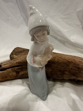 Lladró  figurine titled "Girl with Rooster" or "Shepherdess with Rooster".